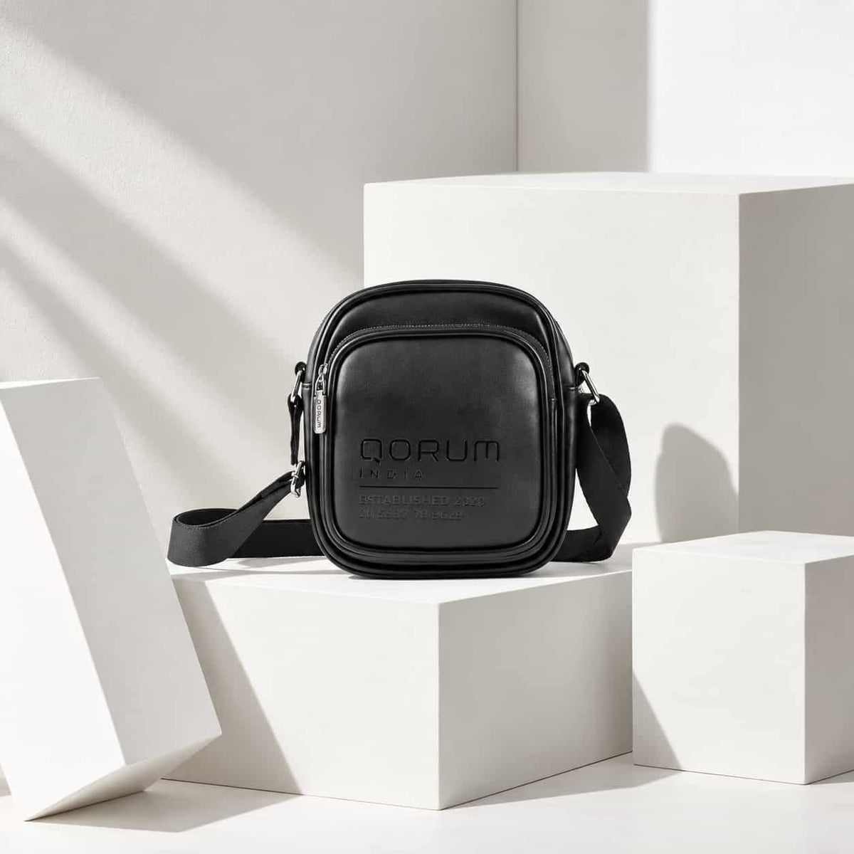 A black leather crossbody bag