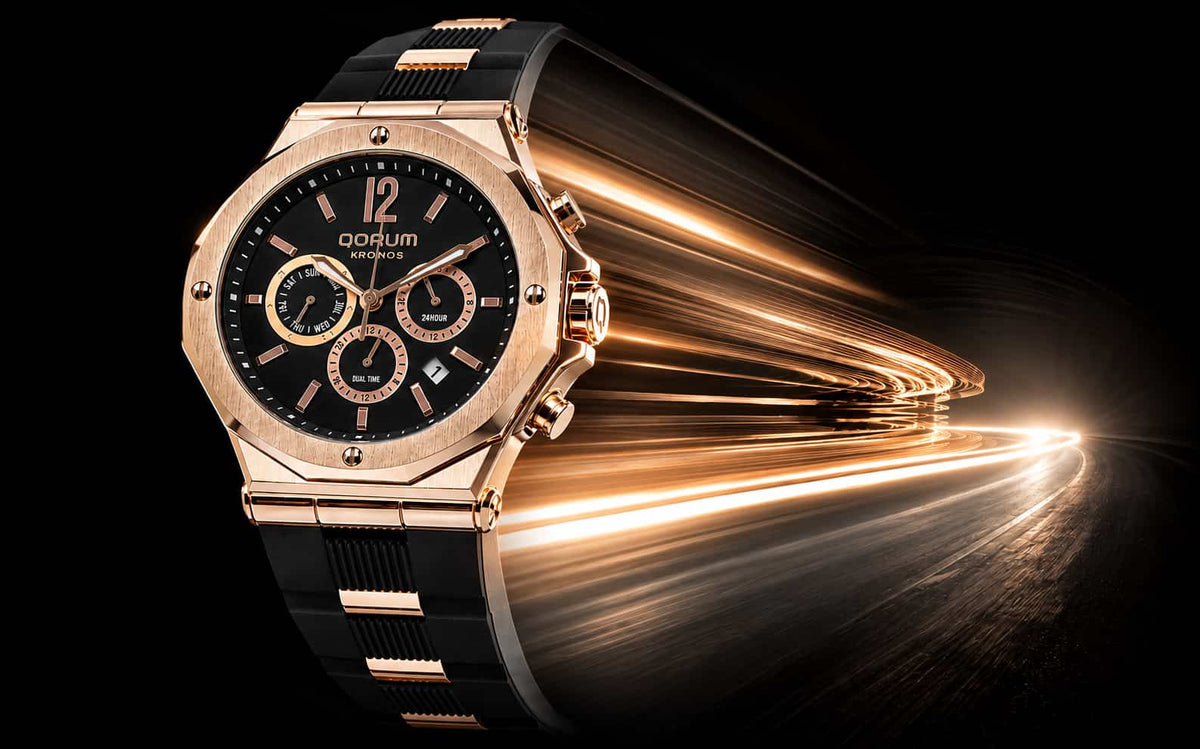 A luxury wristwatch with a rose gold-toned octagonal case, black dial, and black textured strap, shown against a dark background with dramatic golden light streaks.