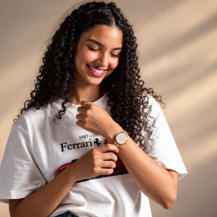 A woman with long, curly dark hair
