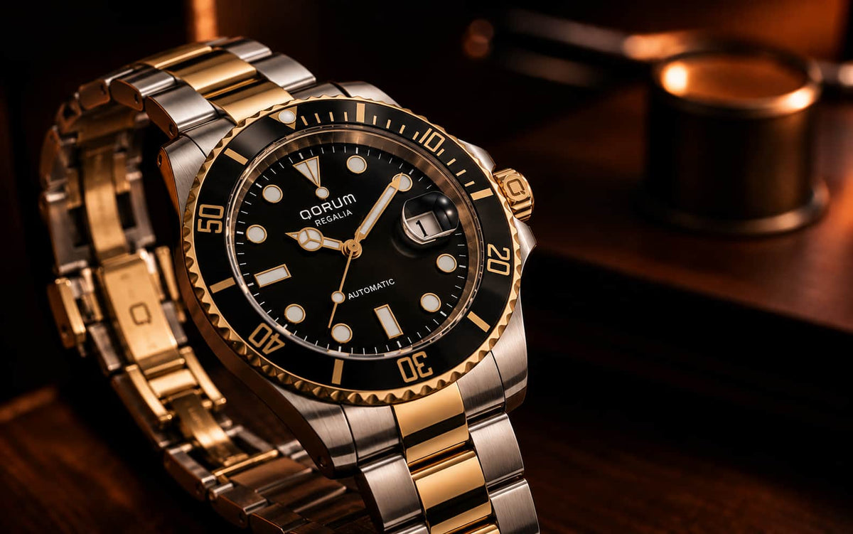 A luxury wristwatch with a two-tone silver and gold-tone metal bracelet, a black dial, and a black bezel with gold-tone markings, resting on a dark wooden surface.