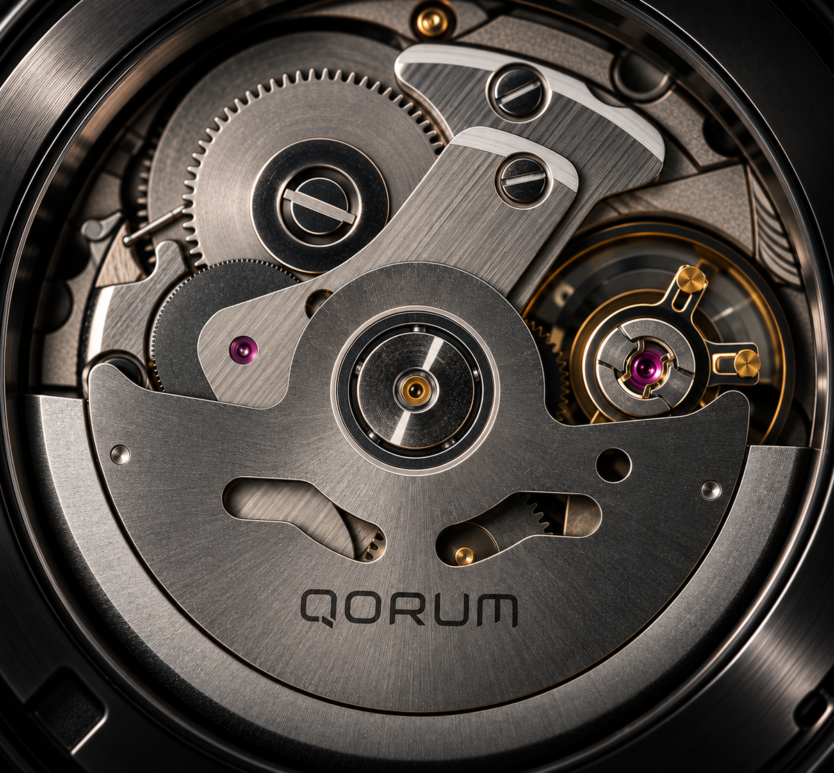Close-up of a QORUM automatic watch movement showing brushed steel gears, bridges, and jewel bearings with a black case rim.